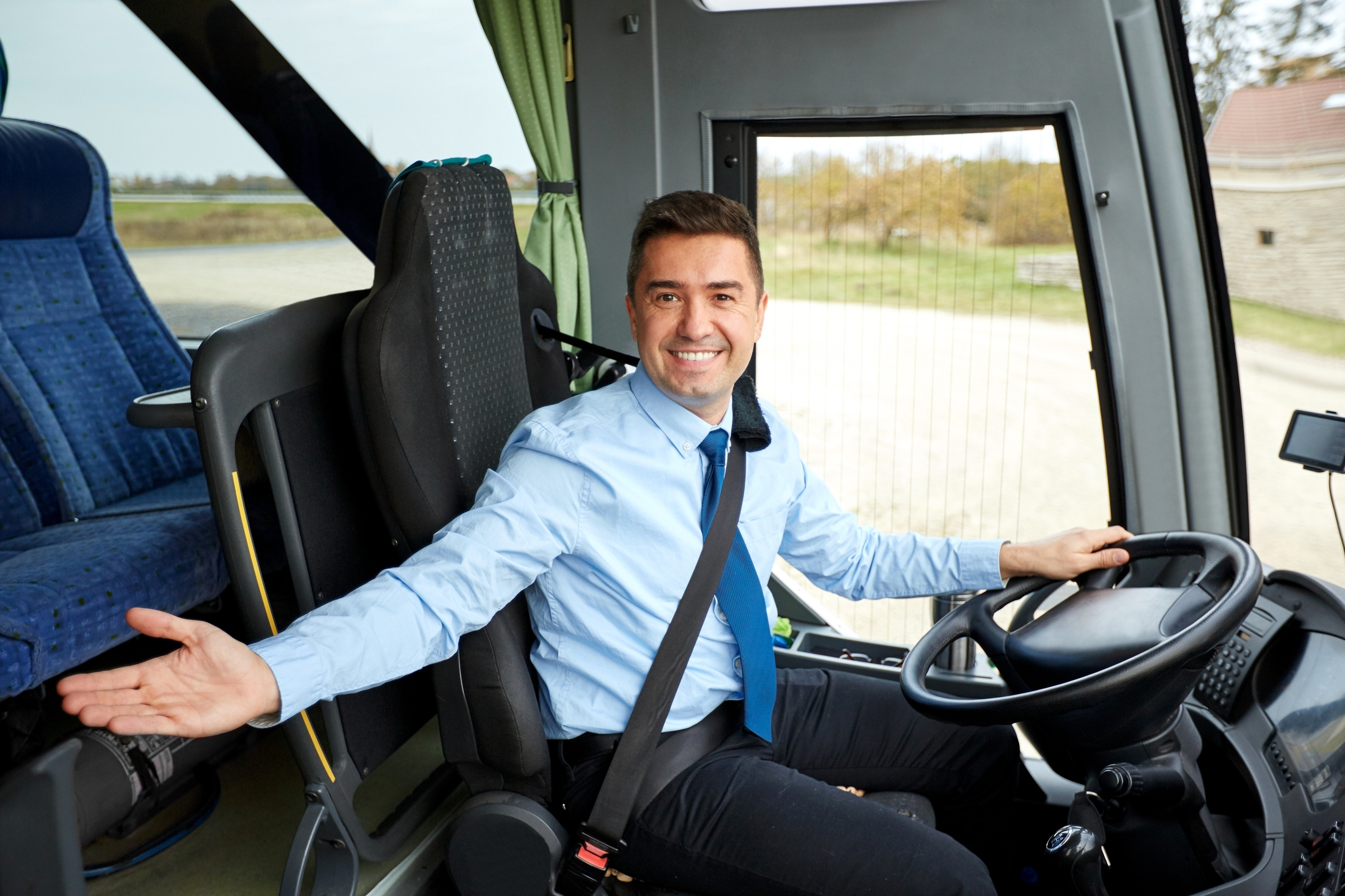 transport, tourism, road trip, gesture and people concept - happy driver inviting on board a tour bus
